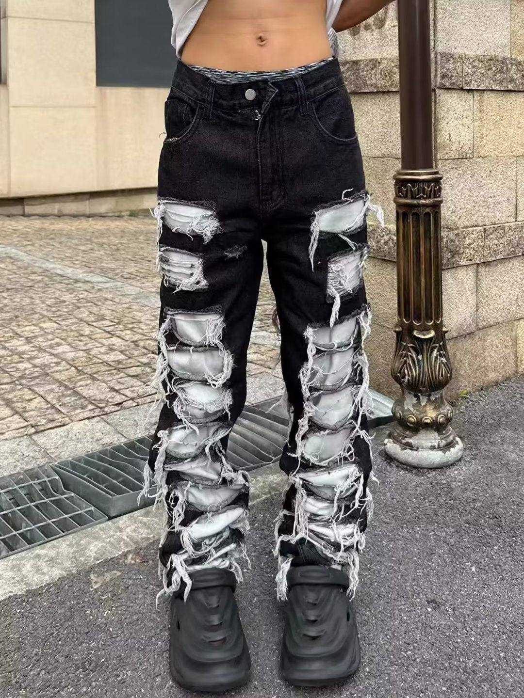 Ripped ripped patch jeans